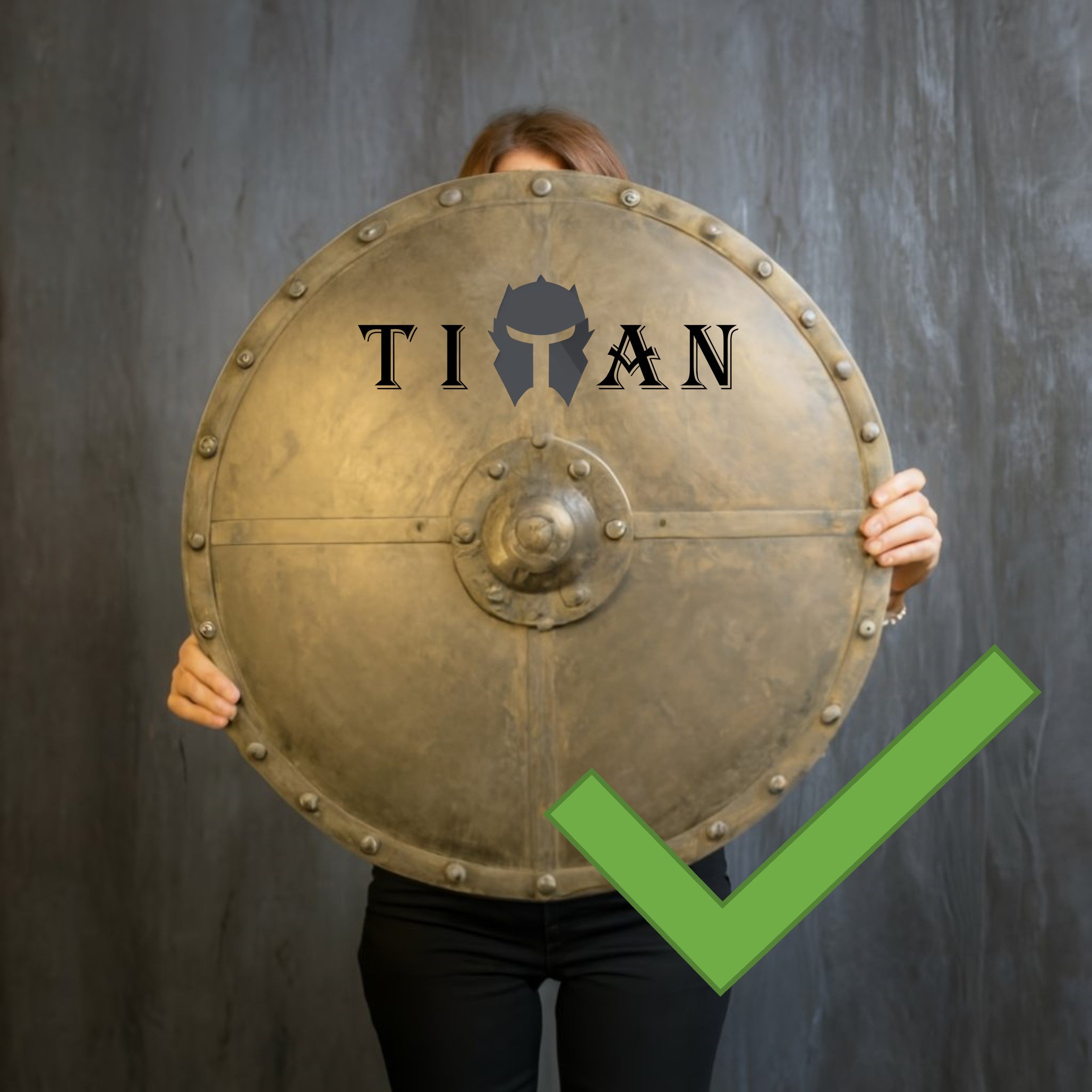 Woman holding a Shield with Titan Wallet logo